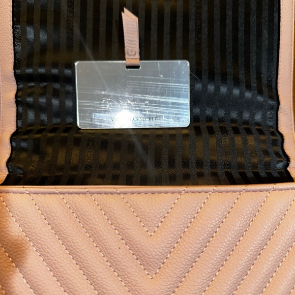Victoria Secret purse has thick gold chain shoulder strap, magnetic snap pinkish